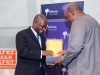 NYU Africa House Director Yaw Nyarko receiving a gift from President John D. Mahama - President John D. Mahama at NYU