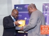 NYU Africa House Director Yaw Nyarko receiving a gift from President John D. Mahama - President John D. Mahama at NYU