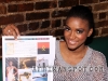 Miss Universe Leila Lopes holding a copy of Afrikanspot