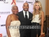 C. Virginia Fields with NFL star Tiki Barber and Traci Johnson